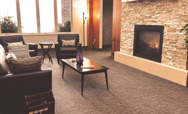 Cozy common area with seating and fireplace