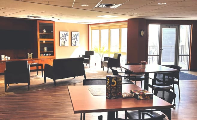 Interior view of a common area with seating and natural light