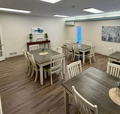 Bright common area with tables and chairs