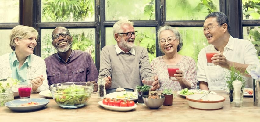 Residents enjoying a meal and conversation together