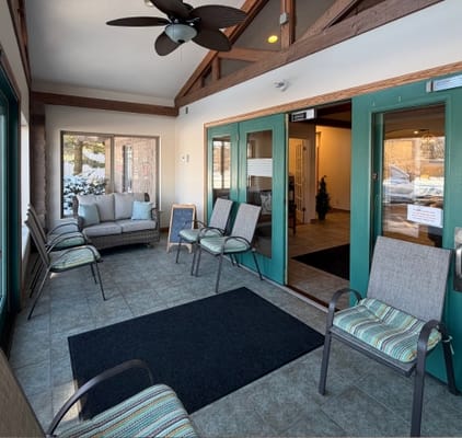 Bright common area with seating near entrance