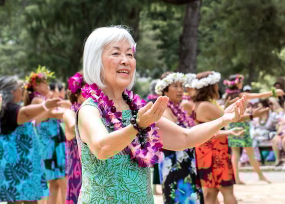 Residents participating in a lively hula dance activity