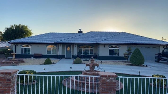 Exterior view of an assisted living facility with landscaped garden