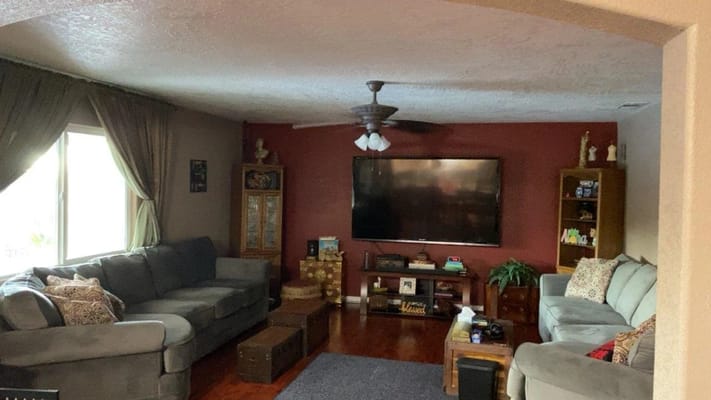 Cozy living room area with seating and television