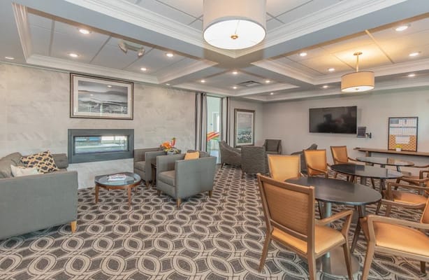 Bright common area with comfortable seating and decor