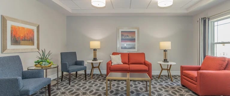 Bright, welcoming common area with seating and artwork