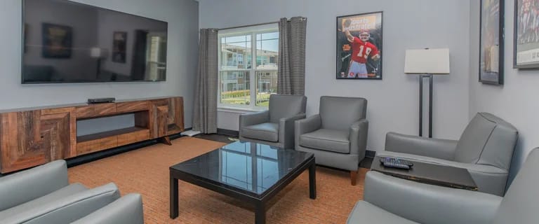 Common area with comfortable seating and a television