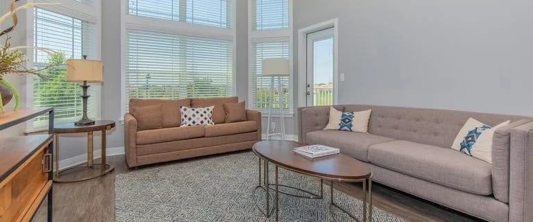 Bright, inviting interior living area with seating