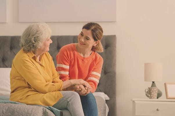 A caregiver and resident engaged in conversation
