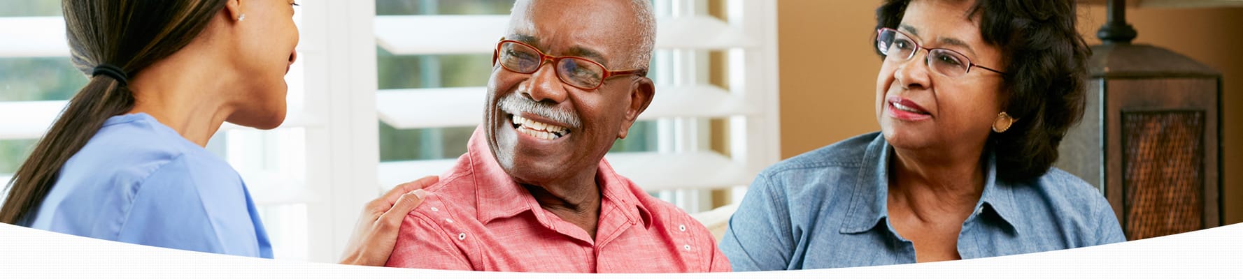 Residents engaged in conversation with staff member