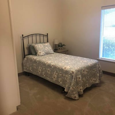 Cozy private room with a bed and natural light