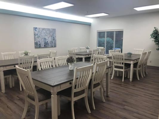 Interior view of a common area with tables and chairs