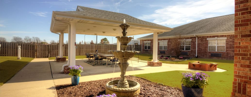 Outdoor courtyard with a fountain and seating area