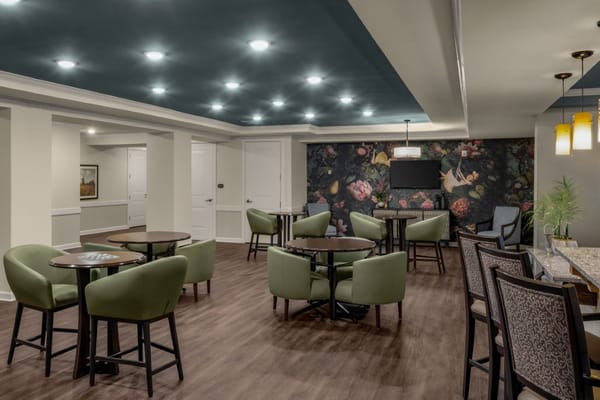 Interior common area with seating and floral wall art