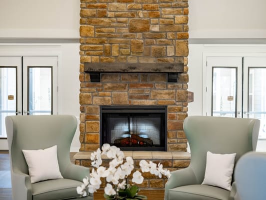 Cozy common area with a fireplace and seating