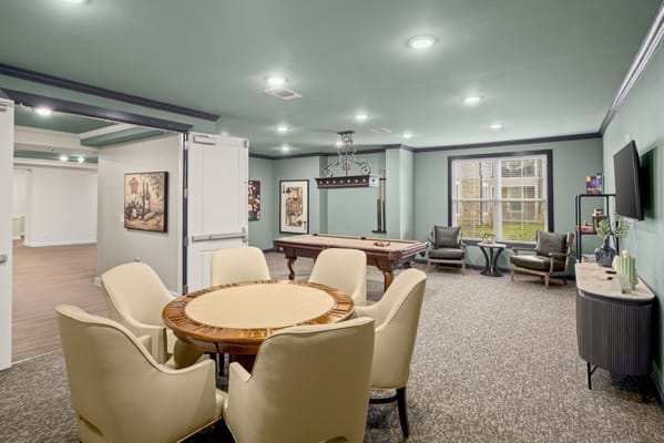 Common area with seating and a pool table