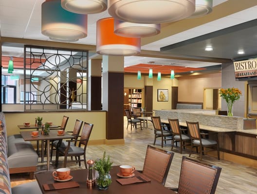 Bright dining area with modern decor and seating