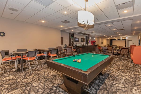 Interior pool table area with seating