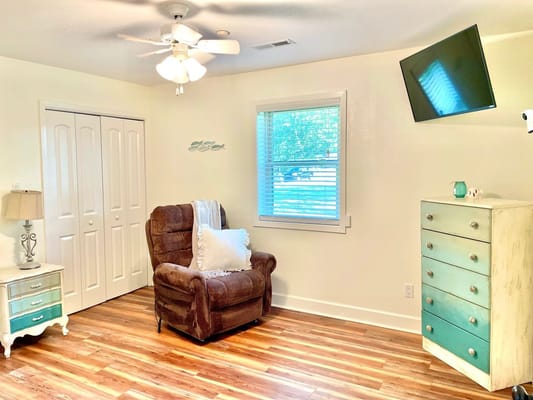 Cozy interior of a resident's room with chairs and decor