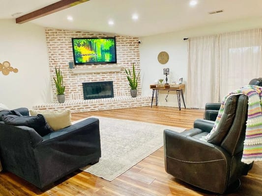 Cozy common area with a fireplace and seating.