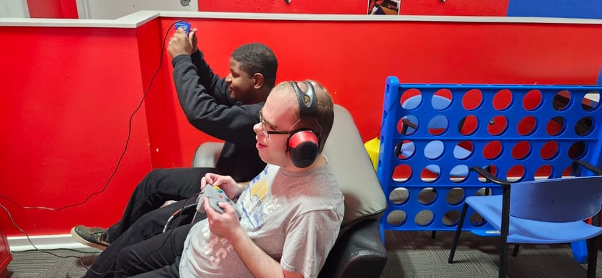 Residents enjoying gaming in an indoor recreational area