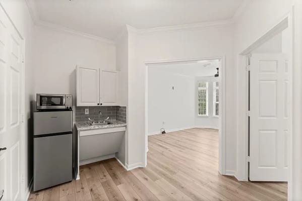 Bright interior space with kitchenette and natural light