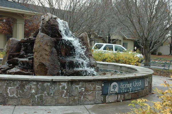 Decorative fountain with cascading water at Edgewood Spring Creek Overland.
