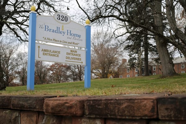 Sign for The Bradley Home and Pavilion showing main entrance