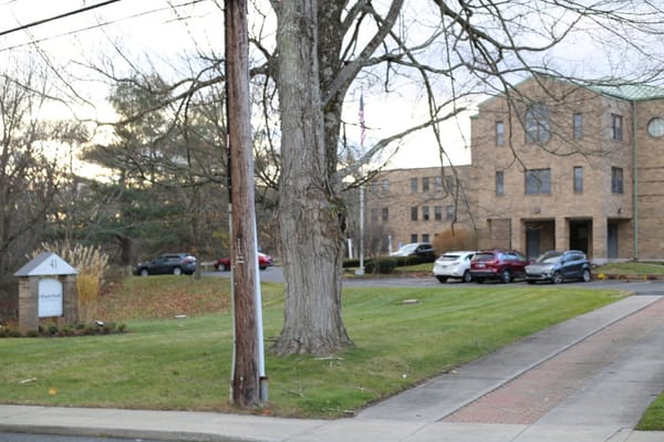 Exterior view of Shady Knoll Center with landscaped grounds