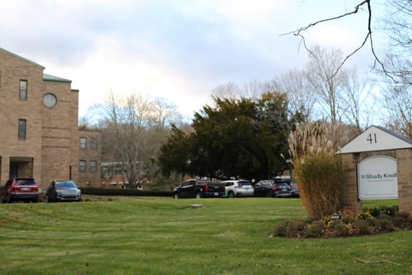 Exterior view of Shady Knoll Center with entrance sign
