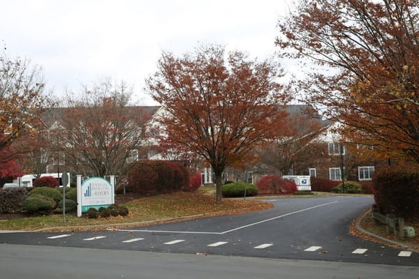 Entrance to the Hamden Health Care Center with fall foliage