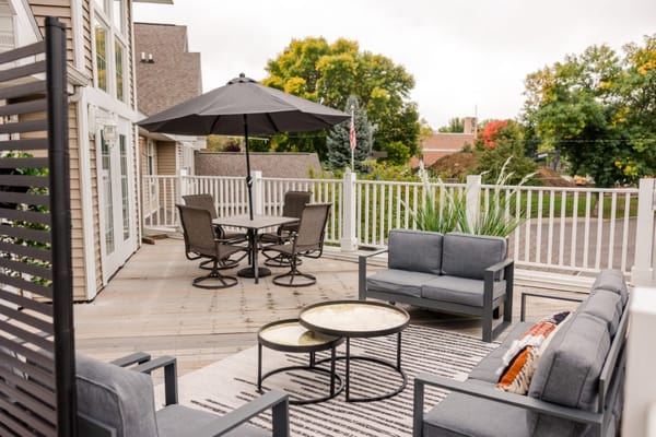 Outdoor seating area with table and umbrella