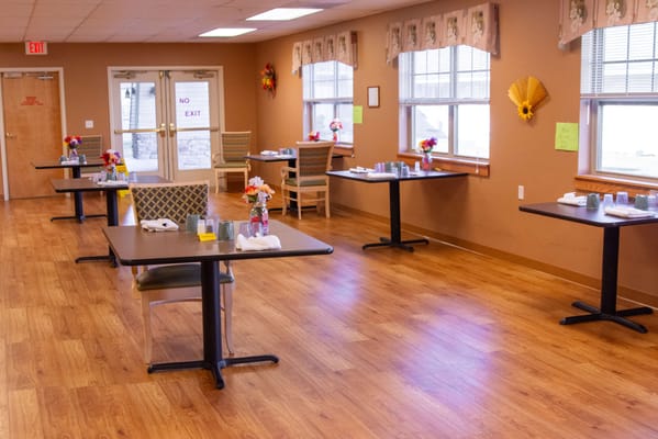 Dining area with tables and floral centerpieces
