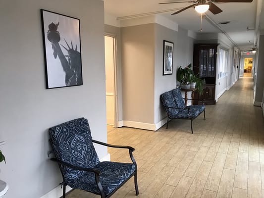 Interior hallway with seating and artwork
