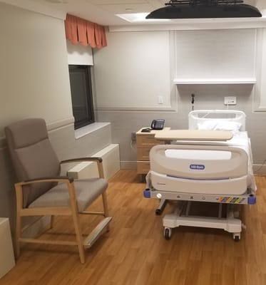 A private resident room with a hospital bed