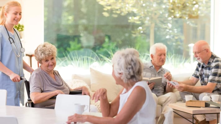 Residents interacting in a bright common area