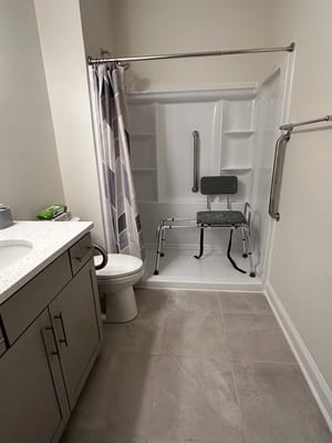 Accessible bathroom with safety features and shower chair