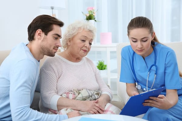Healthcare staff consulting with a senior resident