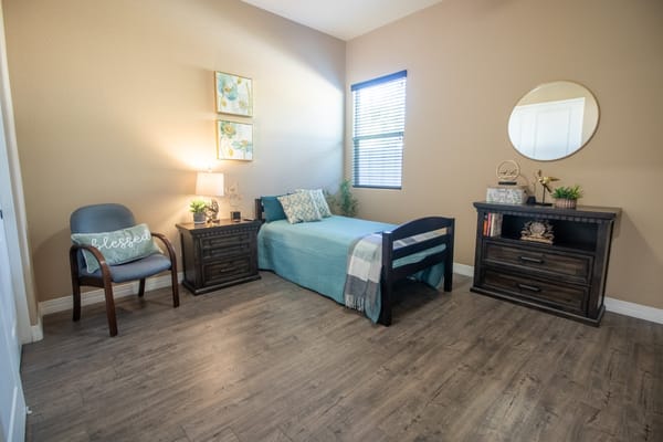 Cozy resident room with a bed and desk