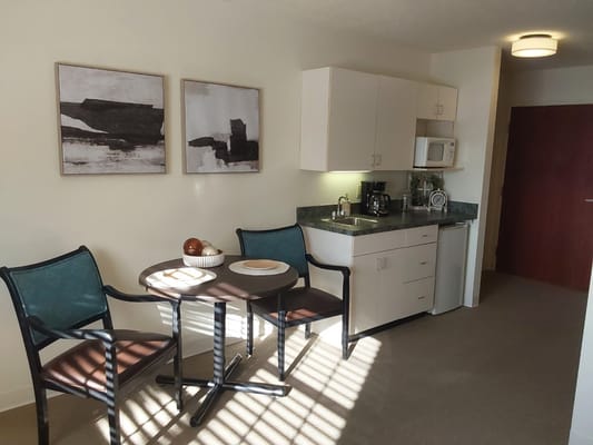 Cozy interior of a private resident room with kitchenette