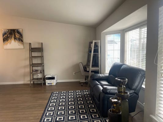 Bright interior space with a couch and bookshelf