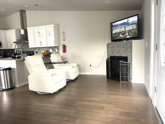 Modern common area with comfortable seating and a TV