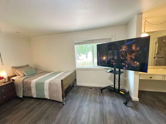 Cozy private room with a bed and TV