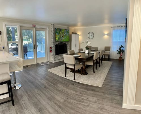 Bright dining area with a large table and chairs