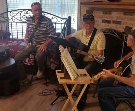 Residents enjoying a music jam session in a common area