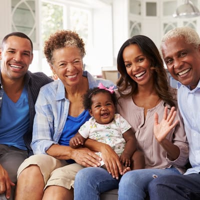 Family gathering with happy residents and a baby
