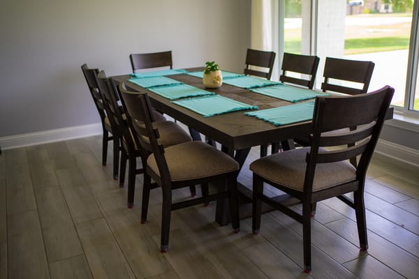 Dining room table set with turquoise placemats