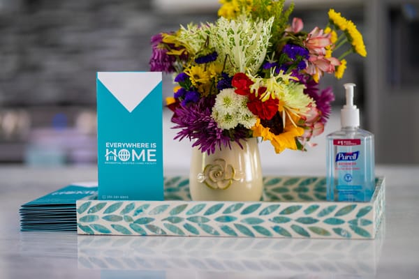 Vibrant flowers and brochures on a table in a common area