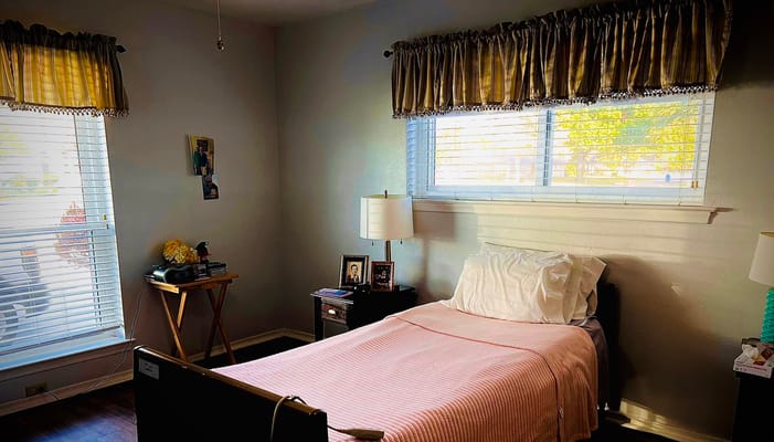 Cozy resident room with bed and personal items