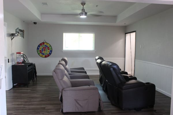 Interior lounge area with seating and a game wheel